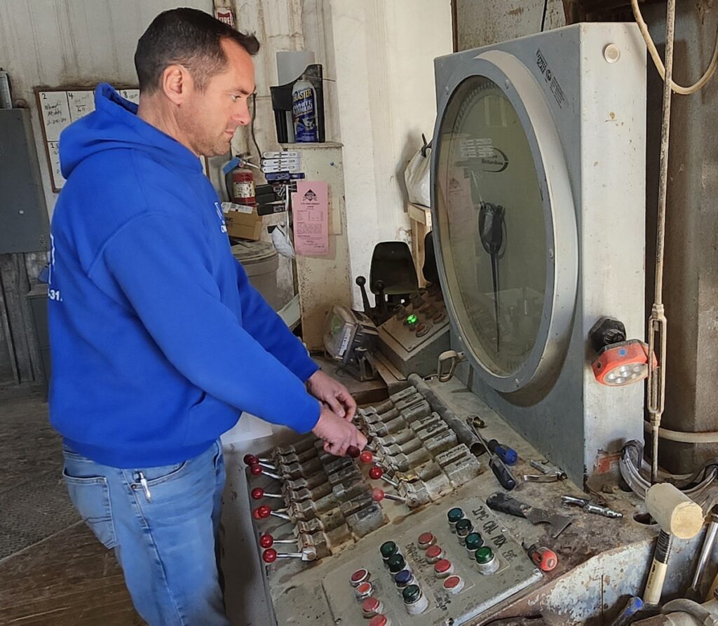 General manager Kevin Van Heusen stands at “the organ,” which regulates inputs when feeds are being mixed. Thee Old Mill manufactures their feeds on site and can make custom mixes for customers.
