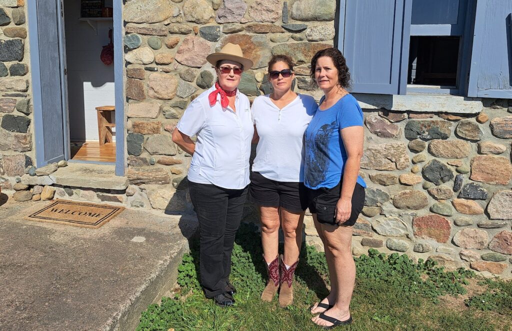Joy Luck, president of the Wooden Old Stone School Association, at left, and her daughters, Erin Wooden Dressel and Heather Wooden Connett.
