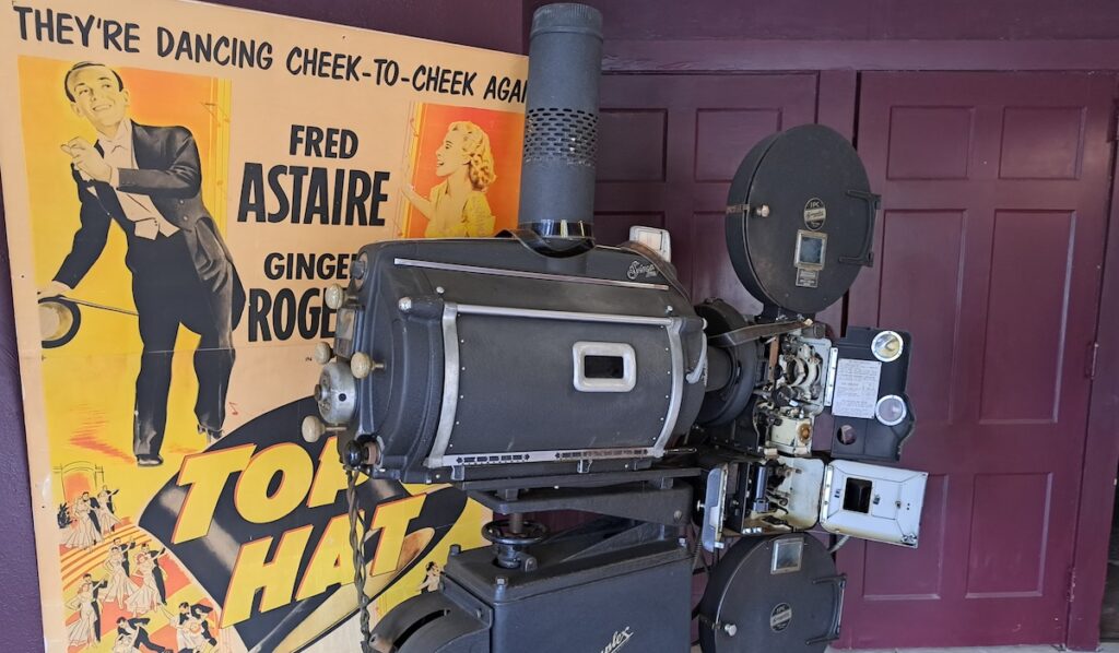 An old projector and movie poster are pictured in the lobby of the Star Theatre in Brooklyn.