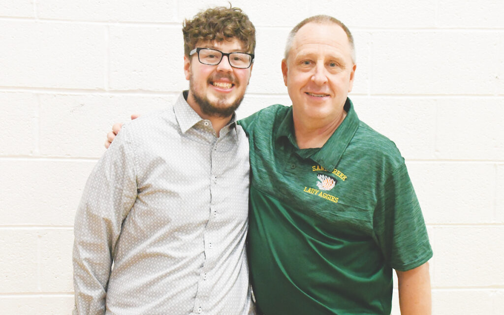Zach Zyla, left, and his father, Mike, coach the girls varsity basketball teams at Britton Deerfield and Sand Creek. (Photo by Erik Gable)