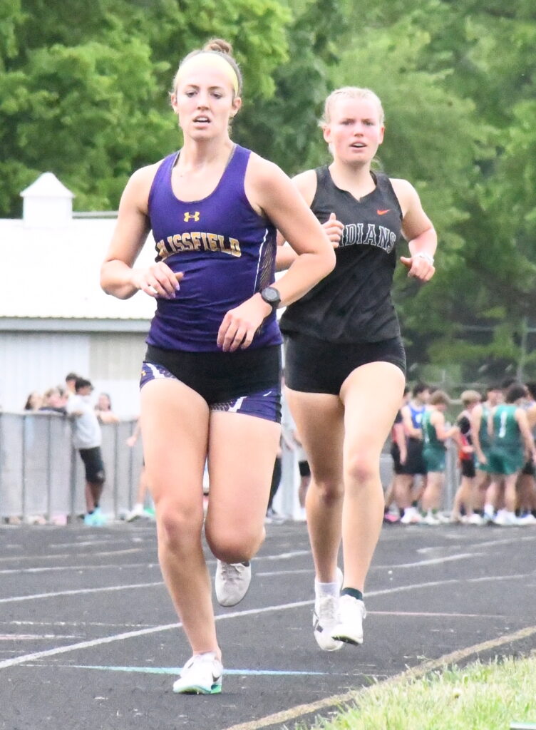 Blissfield’s Hailey Sills leads Maya Whelan from Tecumseh in the 1,600-meter event. Sills finished first with a season-best time of 5:46.40.
