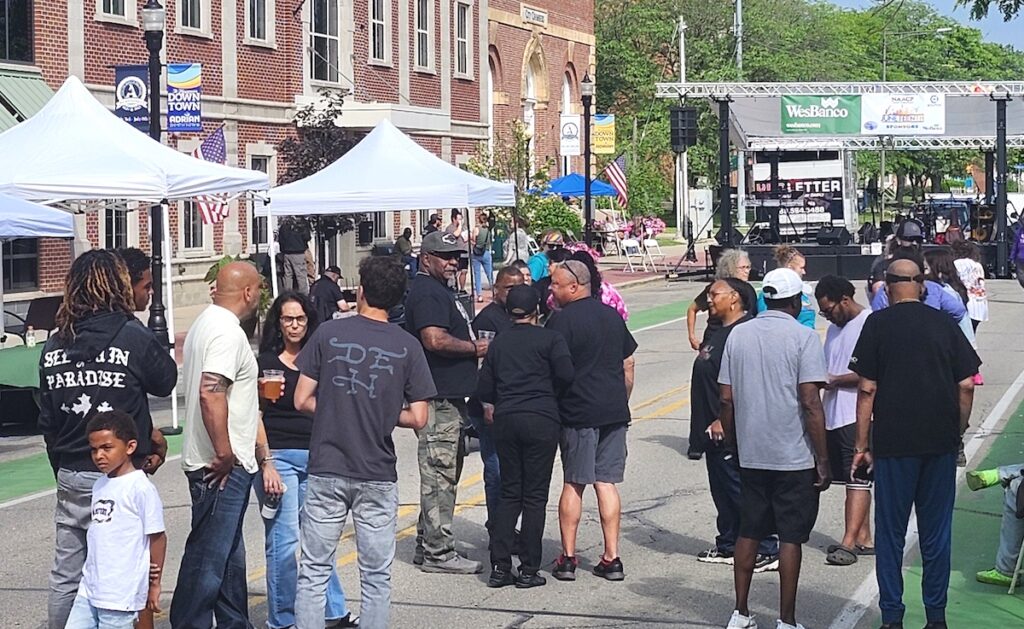 People gather in downtown Adrian for last year’s Juneteenth celebration. (Photo by Erik Gable)