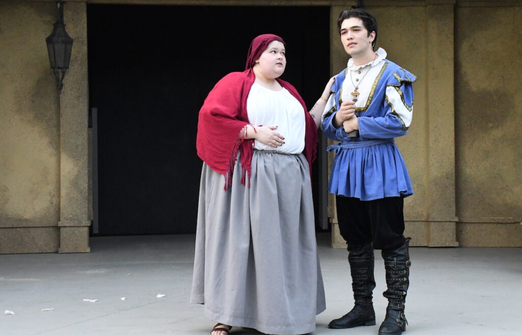 Makana Luana as Juliet's nurse takes a message to Eli Stachowske as Romeo in a scene from the Adrian Shakespeare Co.'s production of "Romeo & Juliet."