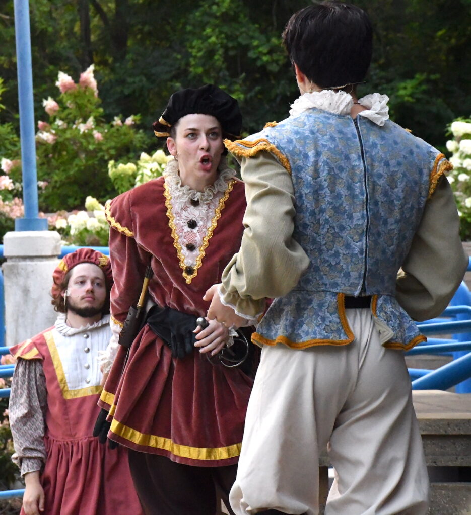 Kyler Mattoon as Tybalt, Juliet's kinsman, confronts Eli Stachowske as Romeo while Dallas Barringer as a servant looks on.