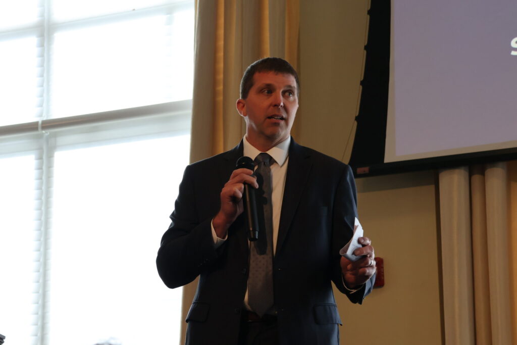 Michigan Department of Agriculture and Rural Development Director Tim Boring speaks at the State of the Western Lake Erie Basin (WLEB) Conference on December 12 at Adrian College.