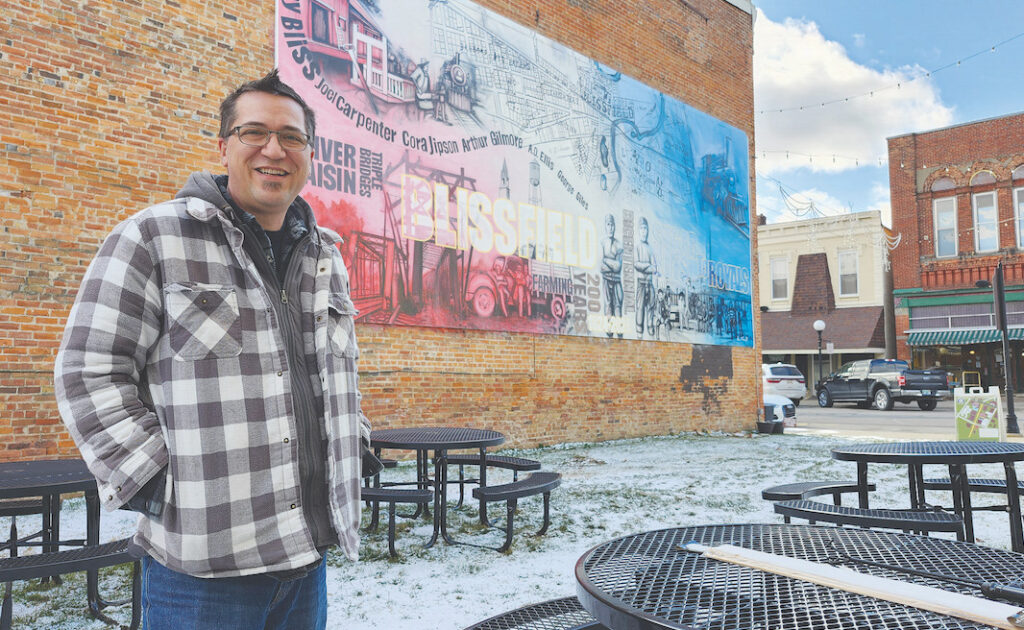 Local artist Barret Dvorsky painted this mural in the 100 block of South Lane Street to mark Blissfield’s bicentennial.