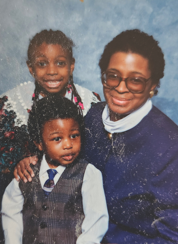 Mariama and John Amara Walters as children, with their mother in a family photo.