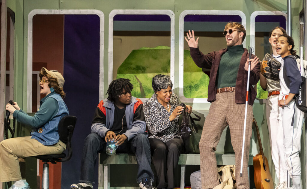 Meg Clark, Zameon Conway, Bennice Byles, Maxwell Lam, Brenna Gifford and Sophie Cox ride the bus in a scene from "Last Stop on Market Street" at the Croswell Opera House.