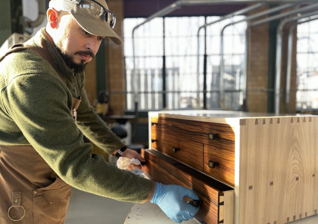 Armando Covarrubias Jr. works on a toolbox during the Sam Beauford Woodworking Institute’s diploma program. Intending to change careers after many years in food science and agriculture, Covarrubias moved from New Mexico to attend the 40-week program, which is in its fourth year and is attracting students from across the country.