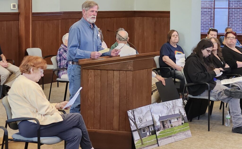 Canterbury Street resident Tim Bakewell addresses the Adrian City Commission on May 6 about Adrian College's planned sports dome adjacent to his neighborhood.