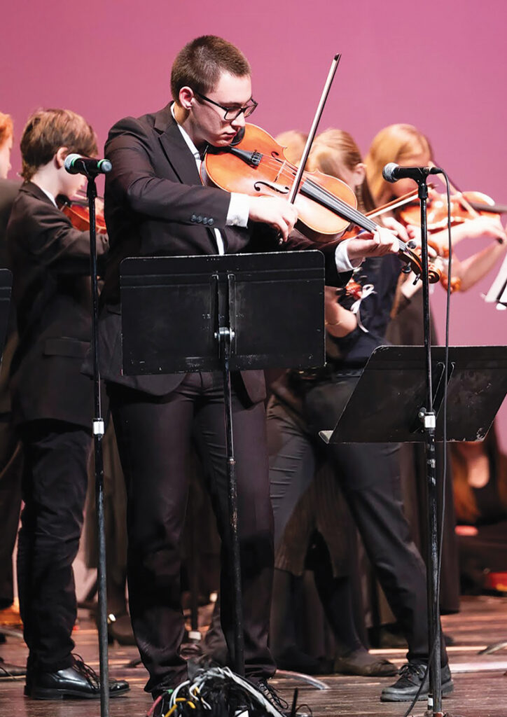 Violist Aidan Gero performs during the Tecumseh Schools Orchestra’s concert with Kittel & Co. on April 15 at the Tecumseh Center for the Arts.