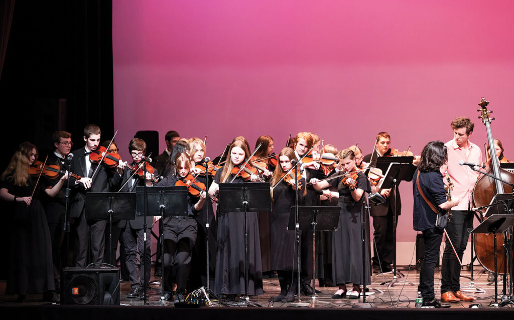 Orchestra students from Tecumseh High School perform with members of Kittel & Co. during a concert at the Tecumseh Center for the Arts. The Tecumseh Schools Orchestra’s guest artist series gives orchestra students a chance to play alongside professional musicians who come into the school district for a mini-residency. The group spent two days working with students and then performed with them in a series of four concerts across two evenings.