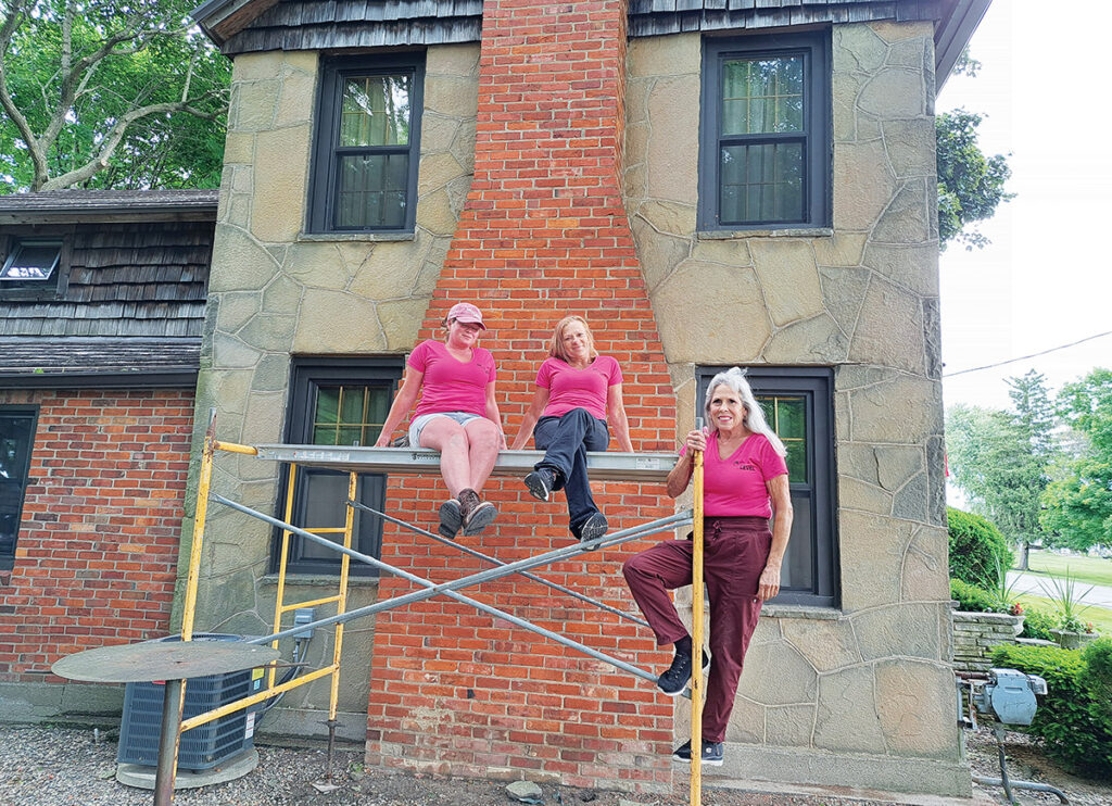 Cagni Karl, Dawn Moran, and On the Level Masonry Restoration owner Jeanie DeCocker are pictured at a job site near Britton.