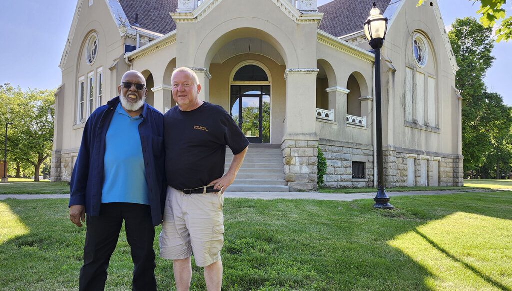 William Hayes, music director emeritus of the River Raisin Ragtime Revue, and William Pemberton, the orchestra’s current executive director, stand outside Haviland Hall, which the organization is working to renovate into a permanent home.
