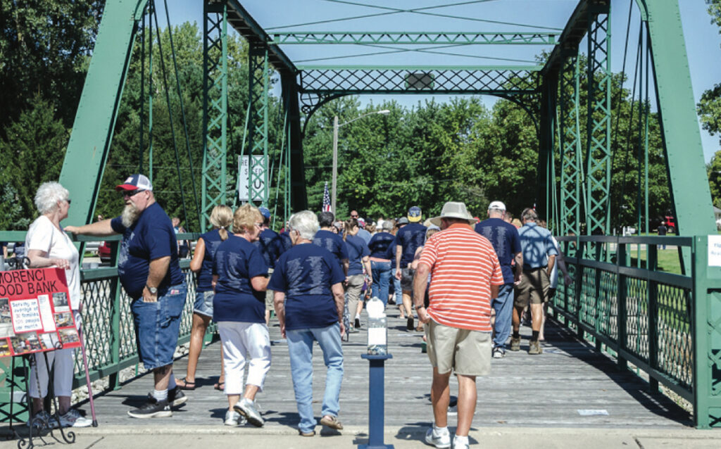 People take part in the 2019 Silver Creek Bridge Walk in this photo from the archives of the State Line Observer.