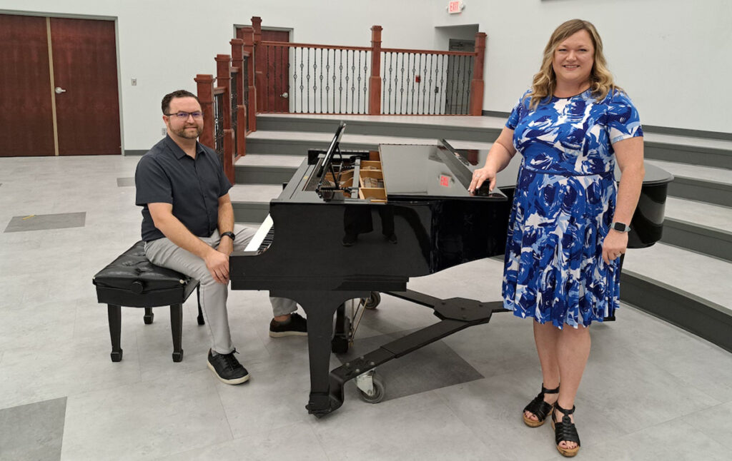 Phillip and Kristin Clark are pictured in Adrian College’s Spencer Hall. Outside of their jobs on the college faculty, she has performed in concerts and operas throughout the U.S. and internationally; he is active both as a soloist and as an accompanist. (Photo by Arlene Bachanov)