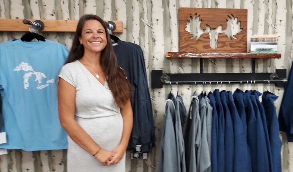 Laura Holser operates The Cottage Door Tecumseh along with her husband. Jim. Michigan-themed clothing and decor is a primary focus.