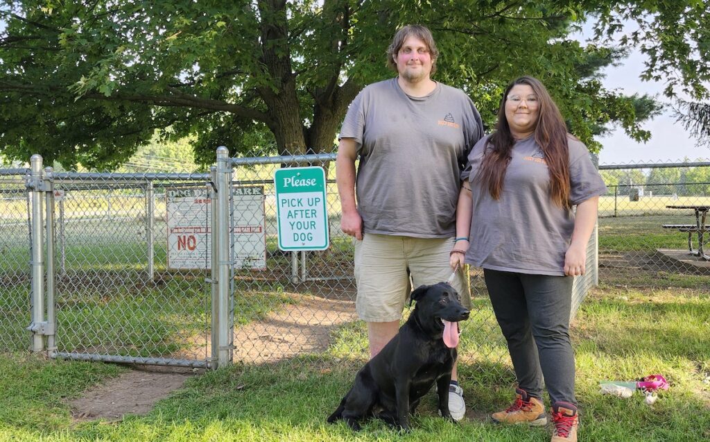 Austin and Jeslyn McMullen, pictured here at the Tecumseh dog park with their dog Izzy, recently started Doggy Doo Duty.