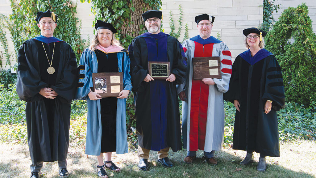 From left to right, Adrian College president Jeffrey Docking stands with faculty members Kristin Clark, Nathan Goetting and Thomas Muntean, and vice president and dean of academic affairs Andrea Milner at the college’s opening convocation on Sept. 4.