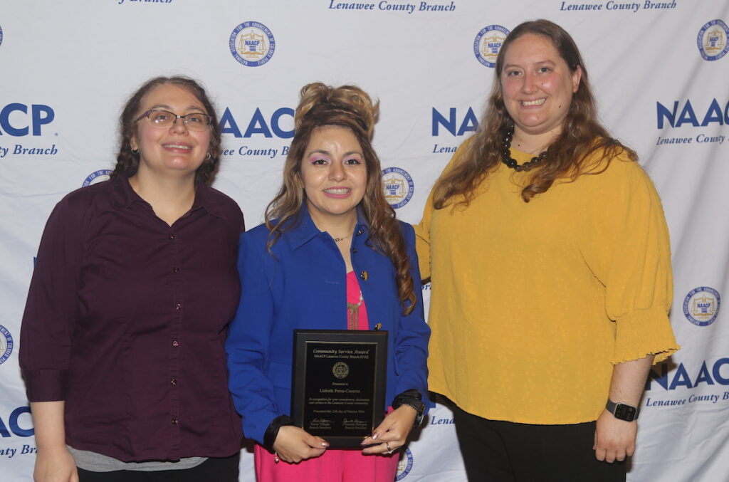 Lizbeth Perez-Cazares, center, is pictured with Adrian District Library colleagues Megan Boles, left, and Chelsey Boss at the Lenawee NAACP’s annual Freedom Fund Banquet at Adrian College.