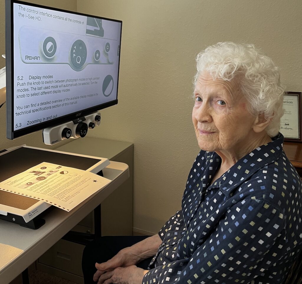 Mable Baty is pictured with a desktop video magnifying reader that allows her to keep reading despite having a degenerative eye condition. The reader was provided by the Adrian Breakfast Lions Club, which works to help area residents who need vision care.