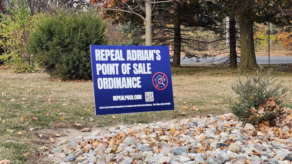 A yard sign urging the repeal of Adrian's point-of-sale inspection ordinance for residential properties is pictured on Nov. 1.