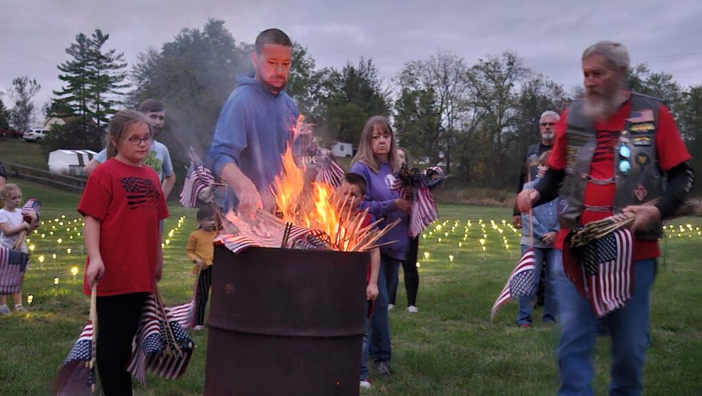 A total of 660 American flags, representing the 22 American veterans lost to suicide every day, are retired by burning in a ceremony on Sept. 30 at Clayton’s village park. The flags were placed in the park at a rate of 22 per day all month.