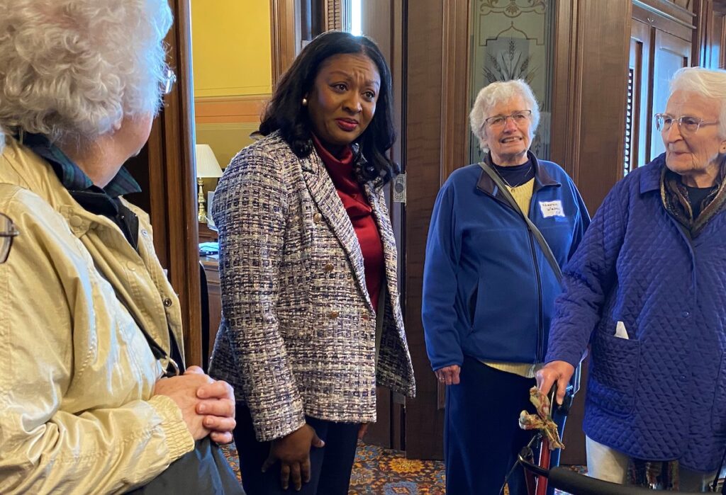 State Sen. Sarah Anthony (D-Lansing), second from left, speaks with Sisters Joyce Caulfield, Sharon Weber, and JoAnn Fleischaker, OP, on Nov. 12 at the state capitol. The sisters were in Lansing to urge passage of the Drive SAFE legislation package. (Photo courtesy of the Adrian Dominican Sisters)