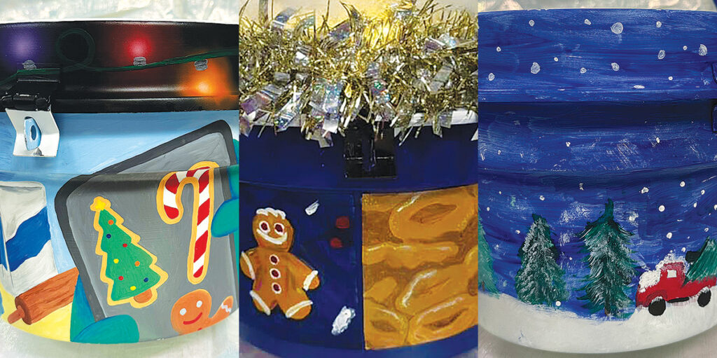 Three of the kettles from the Salvation Army's kettle painting contest, decorated by high school students from Morenci, Adrian and Onsted.