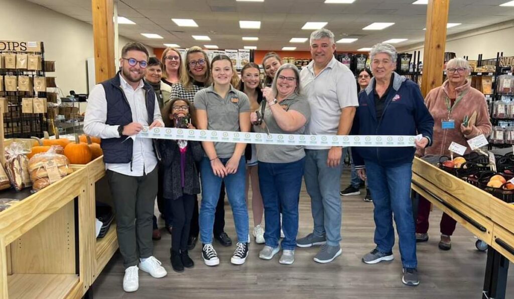 A ribbon cutting was held Nov. 4 at Marks Trading Co.’s new location, 142 N. Main St., Adrian. (Photo courtesy of the Greater Lenawee Chamber of Commerce)