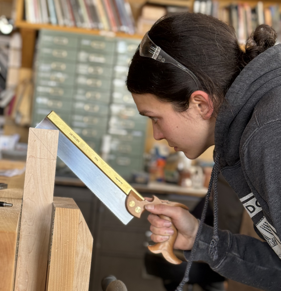 Kloé Campeau works on a project at the Sam Beauford Woodworking Institute in Adrian.