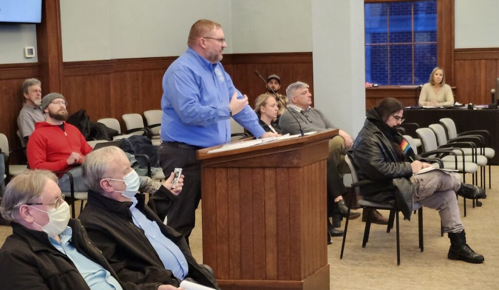 Adrian city commissioner Bob Behnke speaks at the Feb. 17 commission meeting about the process of hiring a new city administrator.