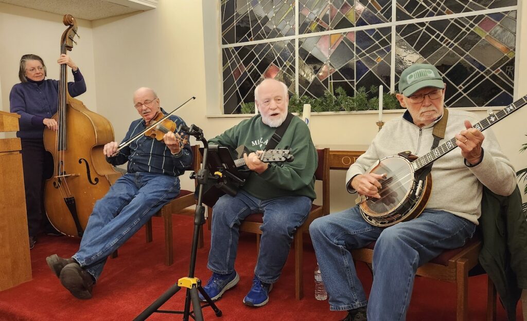 Susan and Mike Gleason of Manchester, Chris Taylor of Toledo, and Jim Balazer of Jackson take part in the Maumee Street Jam on Jan. 11 at the First Presbyterian Church of Adrian.