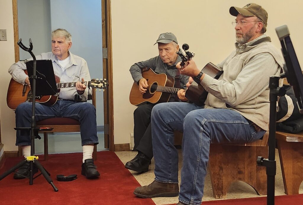 Ron Sutton of Deerfield, Gary Bilby of Addison, and Floyd Wells of Clayton at the Maumee Street Jam.