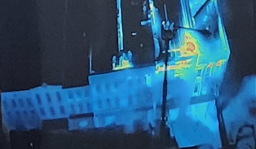 Fire chief Aric Massingill showed city commissioners footage from a thermal imaging drone that helped firefighters on the scene of the March 15 downtown fire. This image is from a photograph of the footage displayed on the TV screen in the city commission chambers.