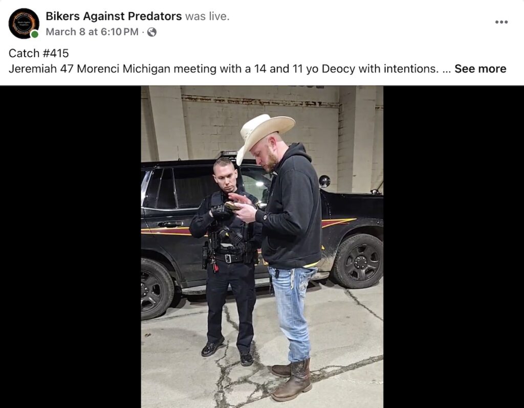 A member of Bikers Against Predators talks with the Morenci police officer who responded to a March 8 sting conducted by the organization in this image from a Facebook Live video.