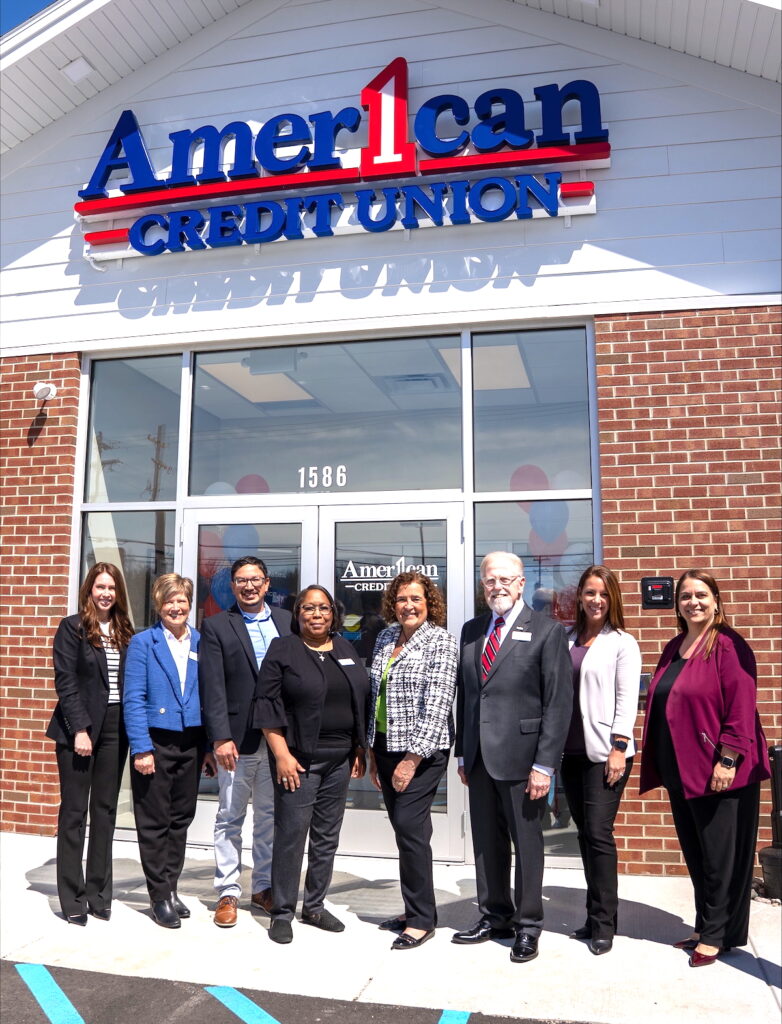 Pictured at the grand opening of American 1 Credit Union’s new Adrian branch are, from left to right, chief finanical officer Sarah Miller; president and CEO Martha Fuerstenau; board members Tim Hernandez, Angella Arnold, Cheryl Schantz and Philip Hoffman; chief operating officer and executive vice president Kristina Edgar; and chief member experience officer Carolyn Duncan.