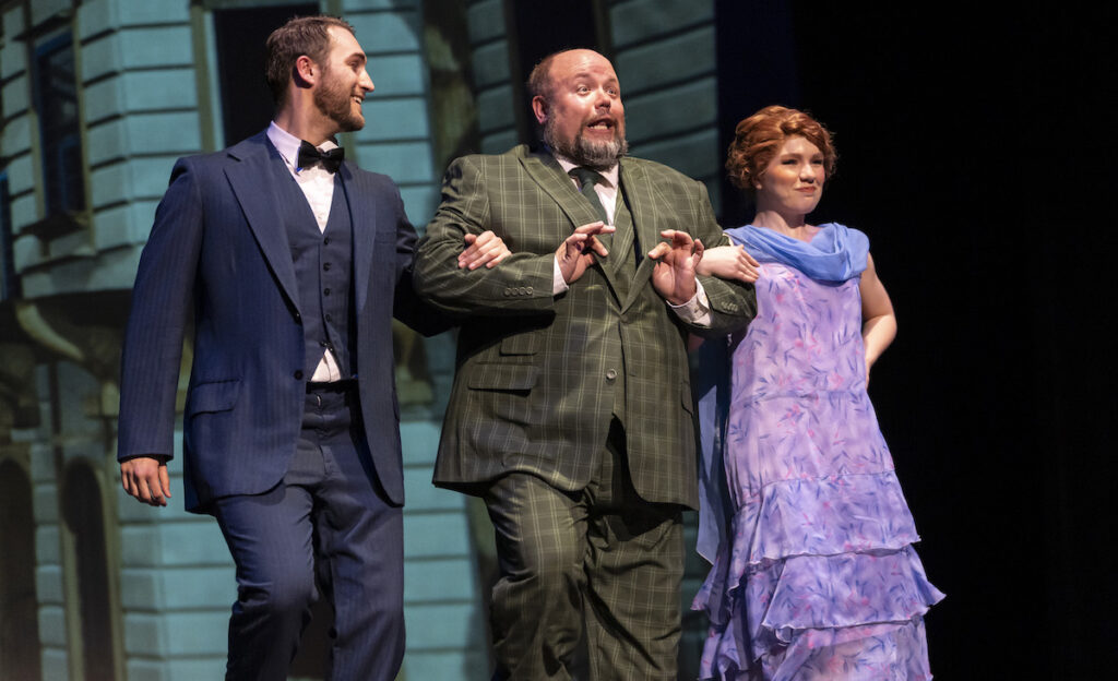 Maxwell Lam as Dmitry, Jeffrey King as Vlad Popov, and Aubrie Lauren as Anya practice to impress the exiled Dowager Empress in a scene from "Anastasia" at the Croswell Opera House. (Photo by Ashlee Sayles)