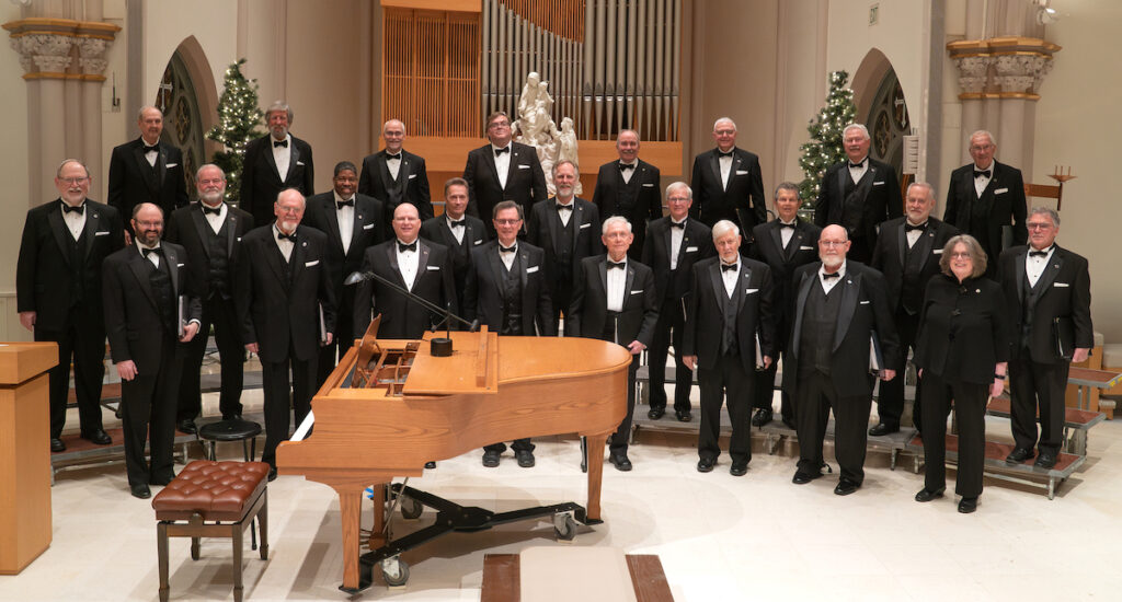Members of the men’s chorus Chiaroscuro are pictured at their Dec. 10 concert with director Susan Matych-Hager.