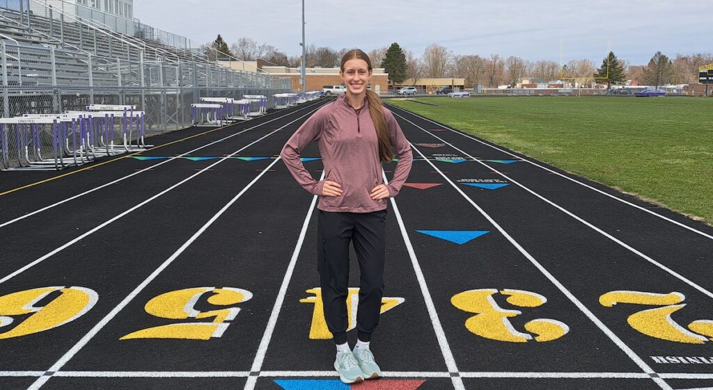 Onsted High School senior Emmry Ross, pictured here on the Onsted track, has been breaking records as a runner throughout her high school career, not just locally but also nationally. (Photo by Arlene Bachanov)