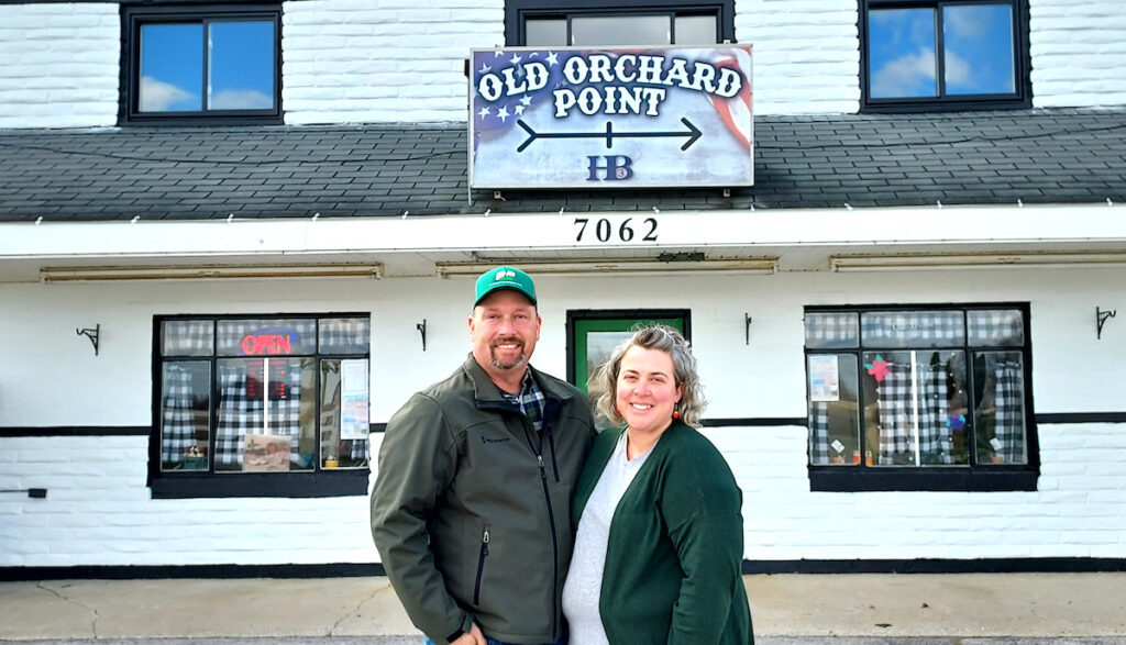 Matt and Hollie Hillard are pictured in front of Old Orchard Point, a family-owned store that sells produce from area farms and a variety of other local products, as well as offering workshops and classes. (Photo by Julie C. Clemes)