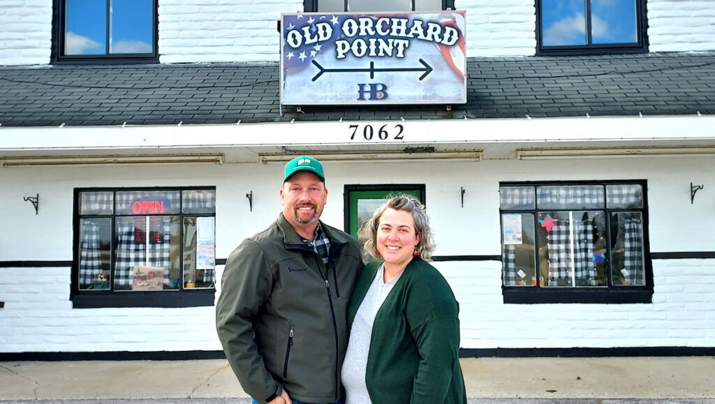Matt and Hollie Hillard are pictured in front of Old Orchard Point, a family-owned store that sells produce from area farms and a variety of other local products, as well as offering workshops and classes. (Photo by Julie C. Clemes)
