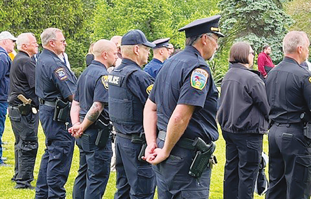 Local law enforcement officers are pictured at last year's memorial ceremony at Oakwood Cemetery. (Photo courtesy of Anne Wisniewski)