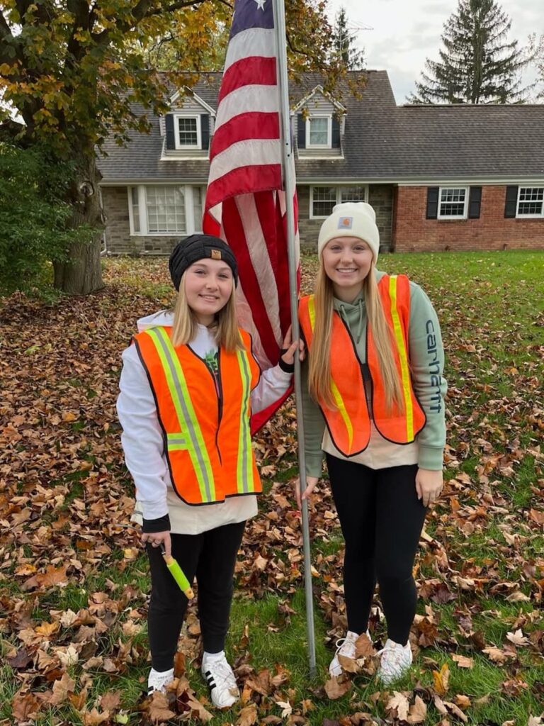 Kameron and Makenna Havens are pictured putting out flags with the Kiwanis Club just before Veterans Day 2023.