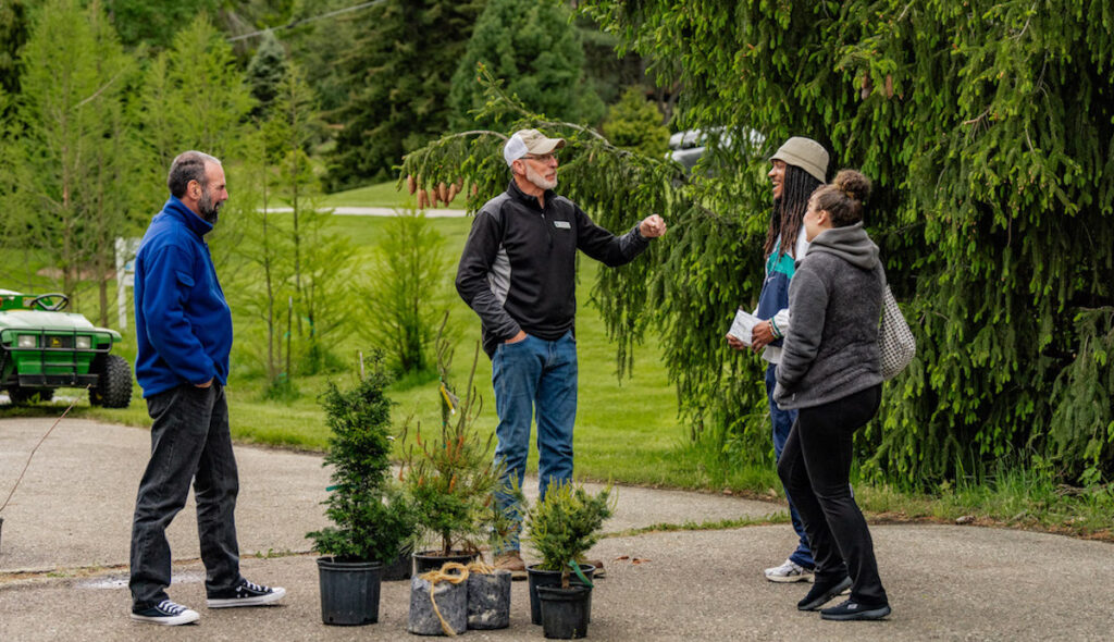Jon Genereaux, Hidden Lake Gardens’ grounds manager, shares his knowledge with shoppers at the 2024 plant sale. This year’s sale will take place on Saturday, May 10.