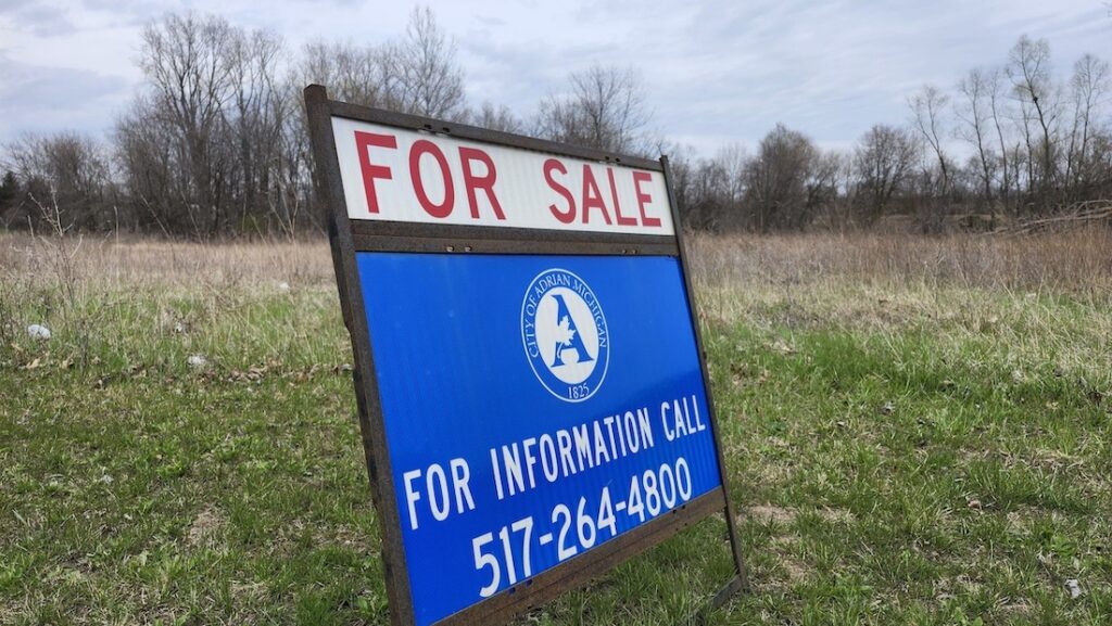A “For Sale” sign sits on the Witt Farm property on the north side of Adrian on April 17. Ann Arbor Spark, an area economic development agency, will pay for site preparation work aimed at making the land more attractive to developers.