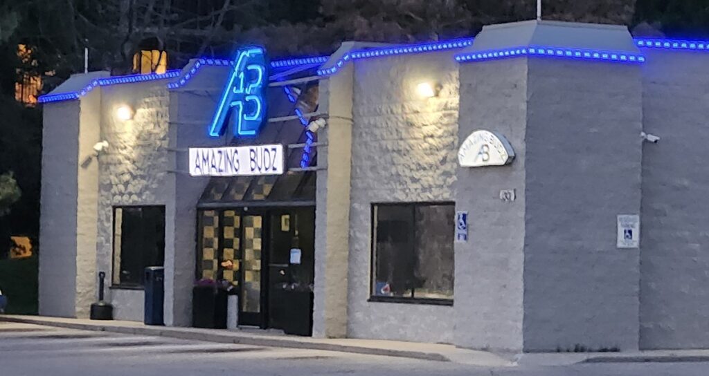 Amazing Budz on South Main Street is pictured shortly after 9 p.m. on a recent evening. Chris Jacobson of Amazing Budz told city commissioners that having to close at 9 p.m. places the business at a competitive disadvantage when stores in Madison Township can stay open later.