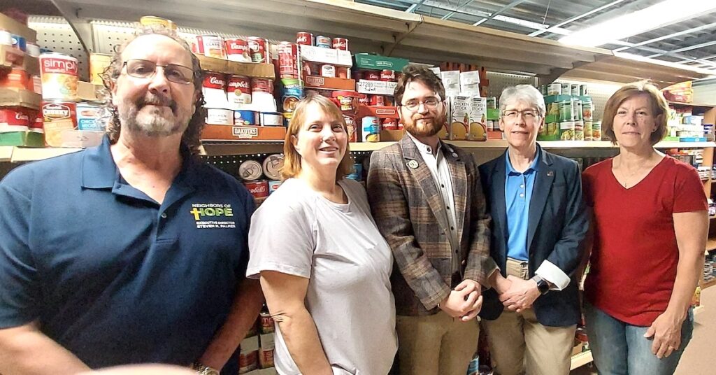 Pictured at the new location of the Fishes & Loaves Food Pantry are Pastor Steven Palmer, executive director of Neighbors of Hope; Cheri Constable, Fishes & Loaves pantry manager; Conner Raymond, First United Methodist Church office manager; the Rev. Alice Ford, pastor of First United Methodist Church; and Marie Bonkowski, Fishes & Loaves volunteer. (Photo by Julie C. Clemes)