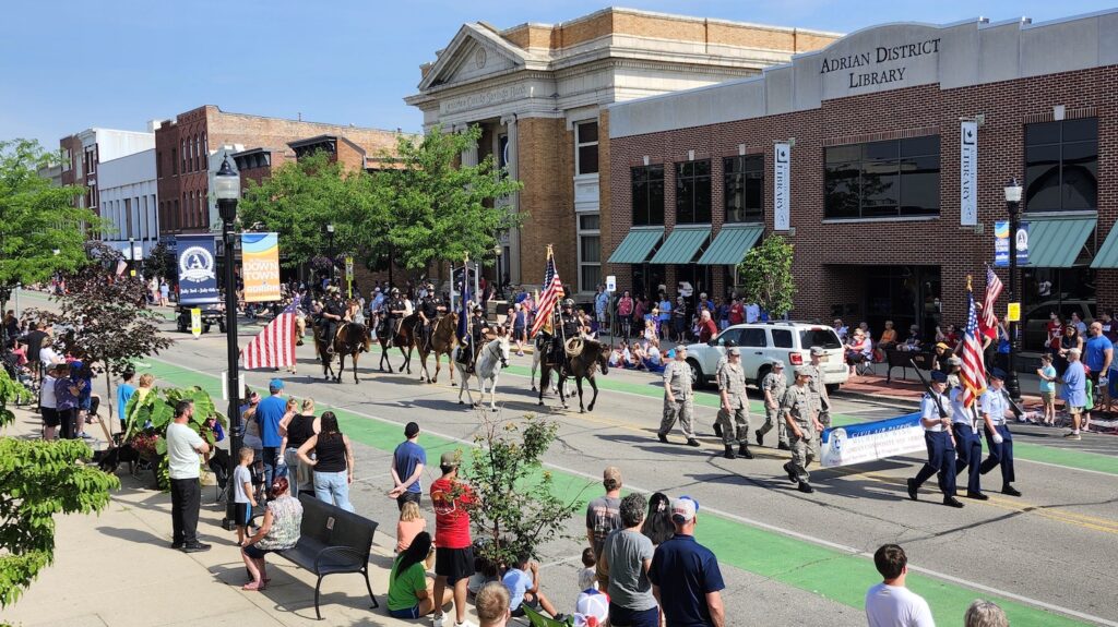 The Michigan Wing of Civil Air Patrol, followed by the Lenawee County Sheriff's Office Mounted Division, leading the Adrian Independence Day and Bicentennial parade.