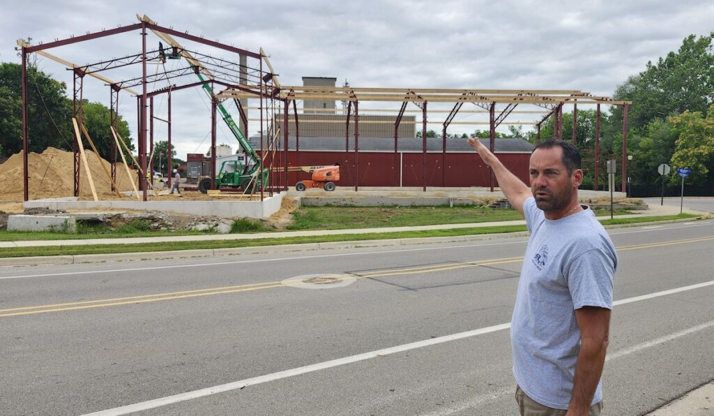 Kevin Van Heusen shows the site of Thee Old Mill’s new warehouse at the corner of Michigan Avenue and Water Street in Adrian. (Photo by Erik Gable)